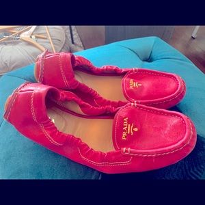 Fushia Prada magic carpet slip on’s
